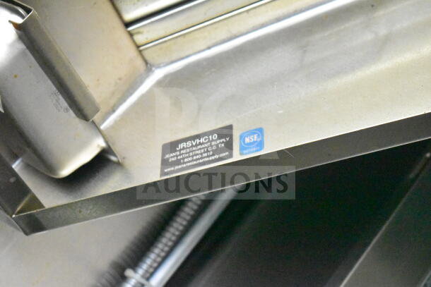 Close-up of CaptiveAire grease hood in Diamond Cargo food trailer with NSF and Jean's Restaurant Supply labels visible.