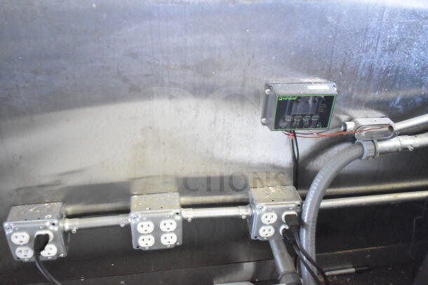 Interior of 2021 Diamond Cargo 8.5'x24' food trailer showing electrical outlets and control panel, indicating operational condition.