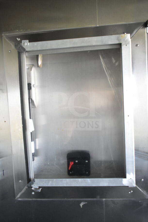 Interior of 2021 Diamond Cargo 8.5'x24' food trailer showcasing metal wall and Ventilation setup. Ideal for mobile catering.