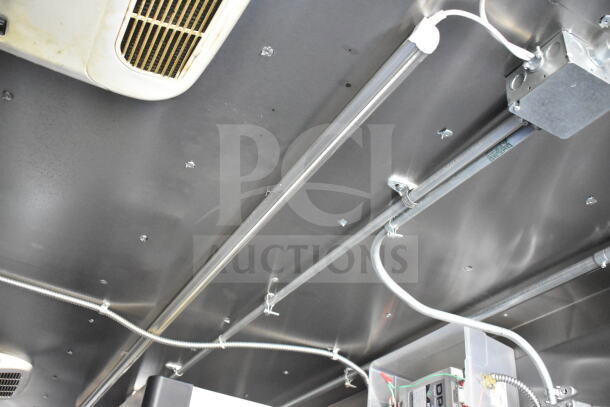 2021 Diamond Cargo 8.5'x24' food trailer interior, showing electrical wiring and ventilation system.