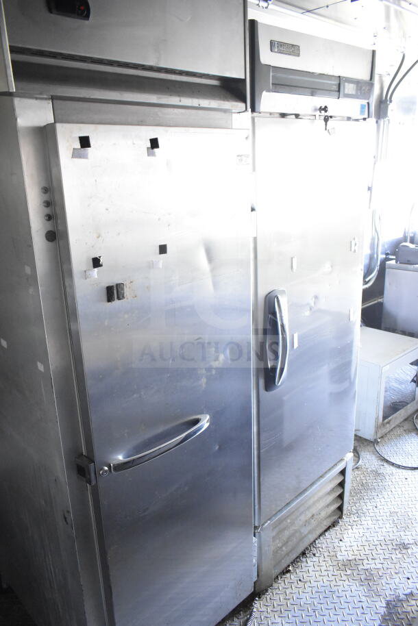 2021 Diamond Cargo 8.5'x24' food trailer interior, featuring stainless steel refrigeration units.