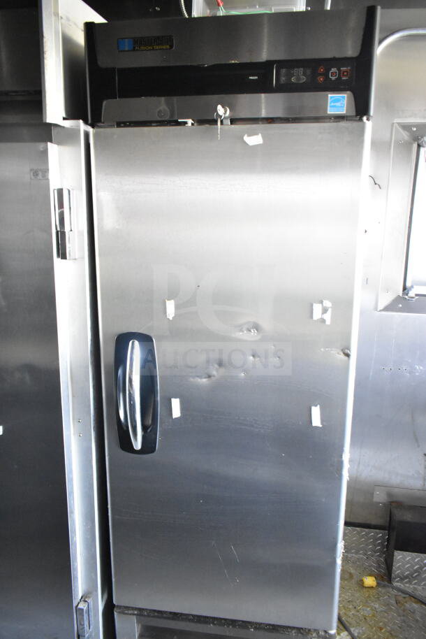 Master-Bilt Fusion Series commercial freezer, stainless steel, visible dents, secure handle, digital display panel.