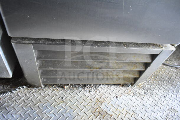 Diamond plate flooring inside 2021 Diamond Cargo 8.5'x24' food trailer, showcasing ventilation vent. Slight dirt visible.