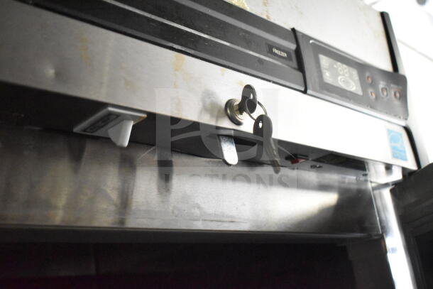 2021 Diamond Cargo food trailer detail, showing CaptiveAire grease hood with control panel and keys inserted. Good condition.