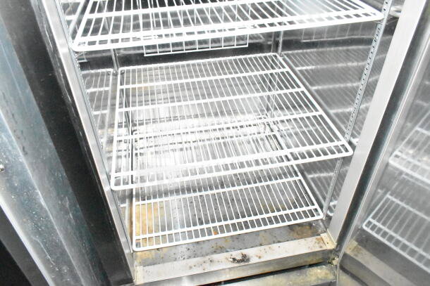 2021 Diamond Cargo 8.5'x24' food trailer interior showing wire shelving and refrigeration unit, clean condition.