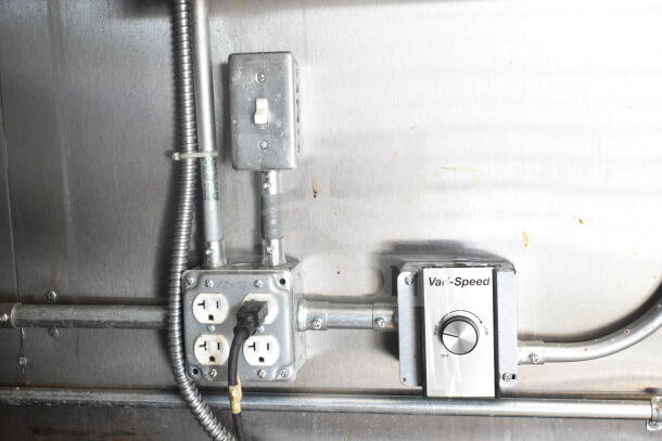 Electrical panel inside 2021 Diamond Cargo 8.5'x24' food trailer, featuring outlets, wiring, and labeled "Vari-Speed" dial.