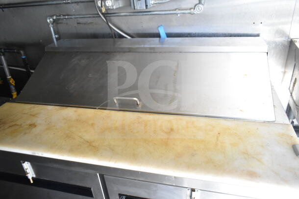 2021 Diamond Cargo food trailer interior showing CaptiveAire grease hood and stainless steel counter.