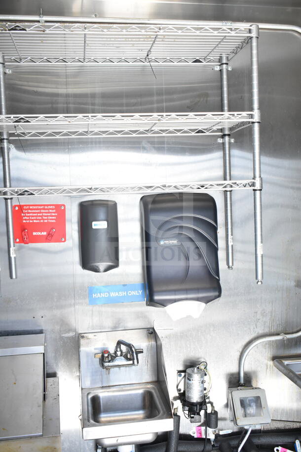 2021 Diamond Cargo food trailer interior with wall-mounted shelves, hand sink, Ecolab dispenser, and San Jamar towel holder.