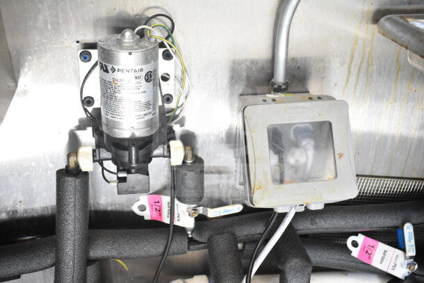 2021 Diamond Cargo food trailer interior showing Pentair Shurflo pump and electrical components with visible labels.