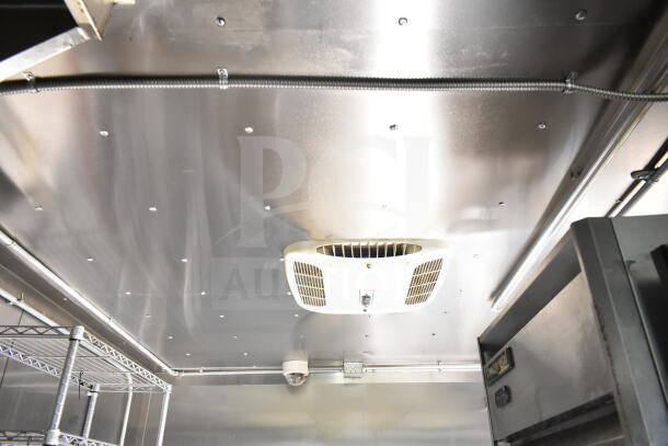 2021 Diamond Cargo 8.5'x24' food trailer interior with CaptiveAire grease hood and Turbochef oven, clean condition.