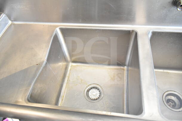 Stainless steel triple sink within the 2021 Diamond Cargo 8.5'x24' Food Trailer; clean and in good condition.