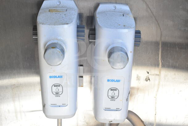 Ecolab water dispensers installed in the food trailer, showcasing product labels and controls.