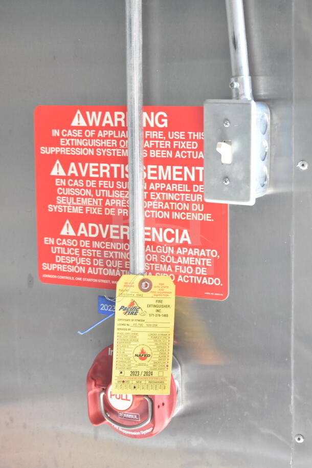 2021 Diamond Cargo 8.5'x24' food trailer warning sign and fire extinguisher inspection tag, emphasizing safety compliance.
