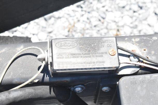 ESCO breakaway switch on 2021 Diamond Cargo 8.5'x24' food trailer. Indicates caution about brake power and corrosion.