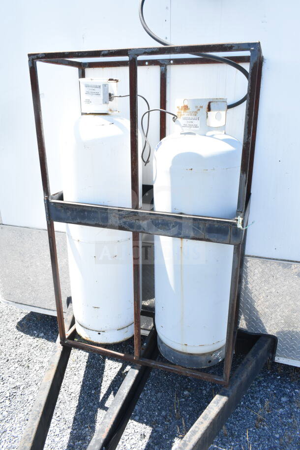 Dual propane tanks securely mounted on the exterior of a 2021 Diamond Cargo 8.5'x24' food trailer.