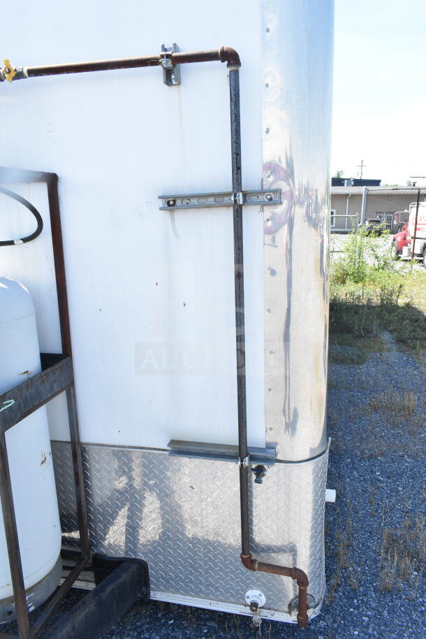 2021 Diamond Cargo 8.5'x24' food trailer, side view, showing exterior piping and propane tank. Silver and white finish.