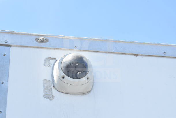 2021 Diamond Cargo 8.5'x24' food trailer, exterior shot showing security camera; features CaptiveAire grease hood.