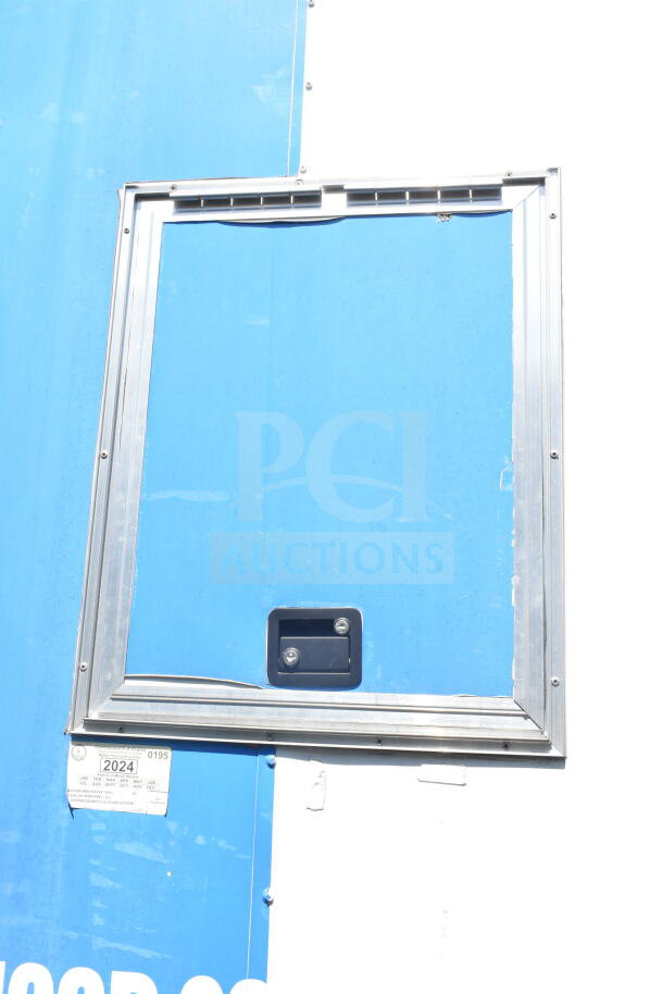 2021 Diamond Cargo 8.5'x24' food trailer, blue exterior, window detail shown. VIN: 53NBE2429M1089847.
