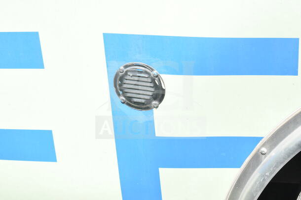 2021 Diamond Cargo food trailer exterior detail showing a vent and part of a blue stripe design.