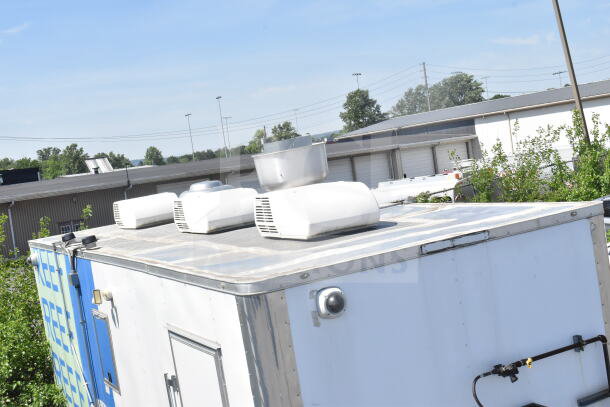 2021 Diamond Cargo 8.5'x24' food trailer with CaptiveAire grease hood, rooftop units, clean exterior, good condition.