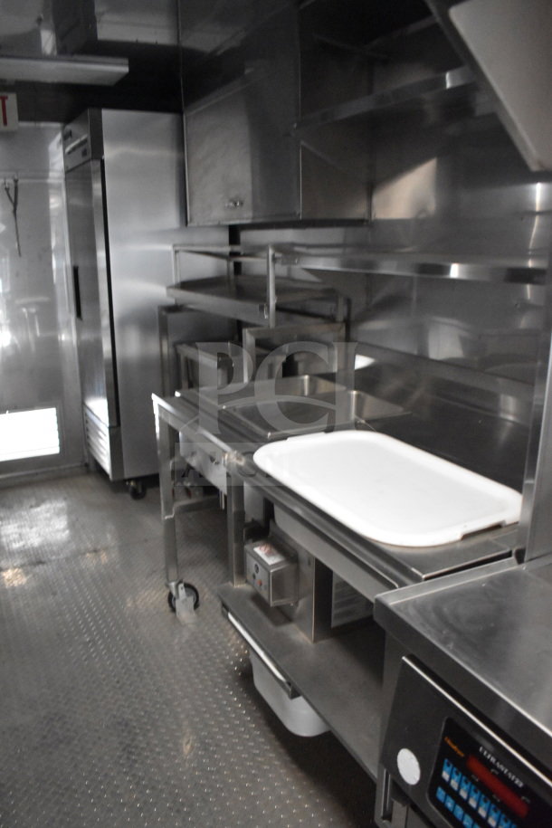 2021 Texino 28ft triple-axle cooking trailer, featuring Ultrafryer Ultrastat23, CaptiveAire hood, True refrigeration, and Winston CVap.