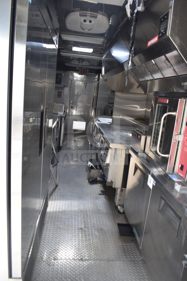 NEW 2021 Texino 28ft cooking trailer interior, featuring Ultrafryer Ultrastat23 fryer, CaptiveAire hood, True refrigeration.