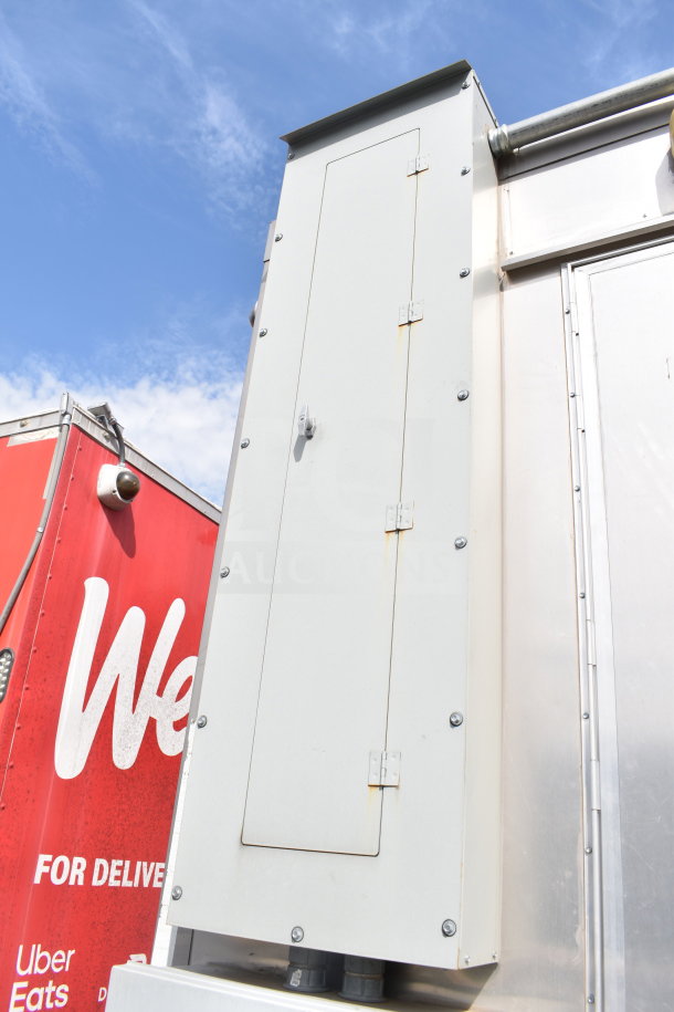 Exterior view of a 2021 Texino 28ft Triple-Axle Cooking Trailer with Popeyes configuration, featuring a CaptiveAire hood system.
