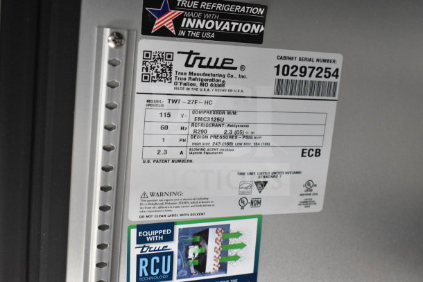 Label on a True Refrigeration unit showing model TWT-27F-HC, serial number 10297254, and compressor EMC3125U details.
