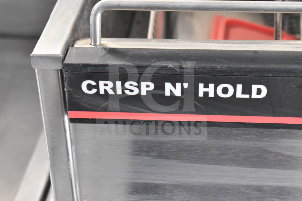 "Crisp N' Hold" label on stainless steel cooking equipment inside 2021 Texino cooking trailer.