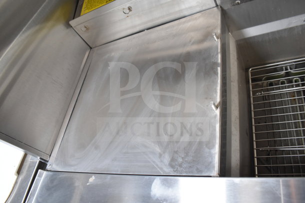 Stainless steel cooking surface of 2021 Texino 28ft trailer with Ultrafryer Ultrastat23. Clean and well-maintained condition.