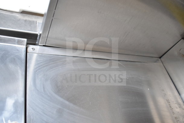 Interior view of 2021 Texino 28ft cooking trailer's stainless steel surface, showcasing durable construction and quality finish.