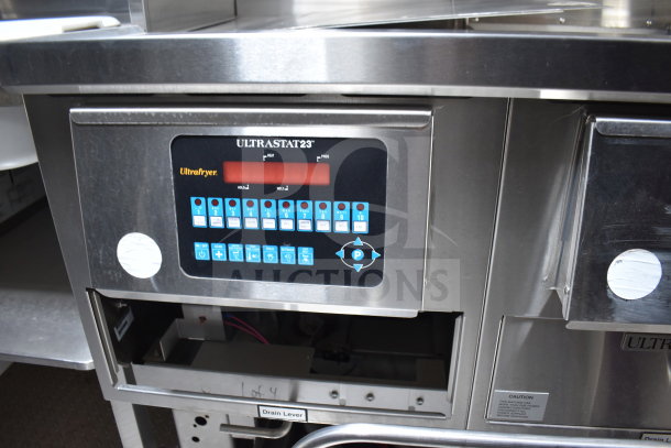 Ultrafryer Ultrastat23 control panel on a 2021 Texino cooking trailer, featuring programmable settings and a digital display.