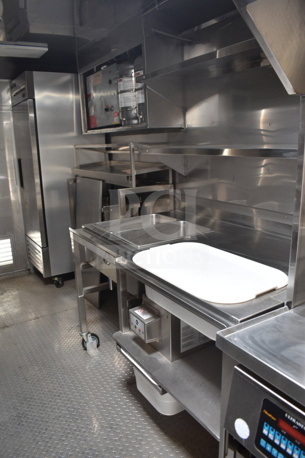 New 2021 Texino 28ft cooking trailer interior, featuring Ultrafryer Ultrastat23, CaptiveAire hood, and 2021 True refrigeration.