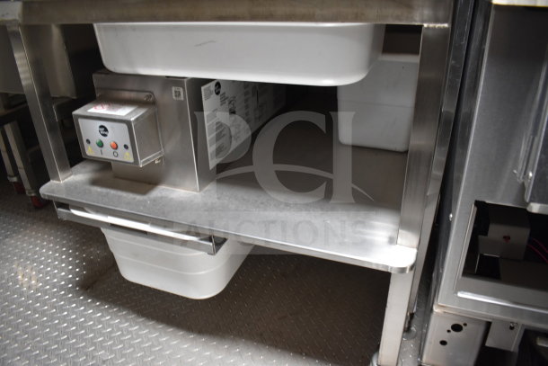 Alt text: Interior of Texino 28ft trailer showing stainless steel equipment, including Winston CVap Holding unit, on anti-slip flooring.