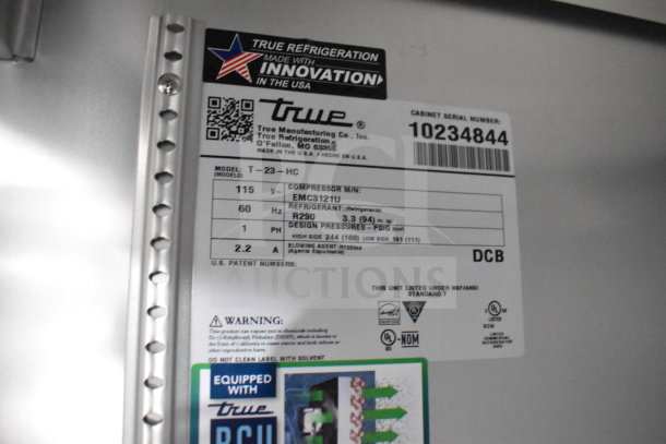 Label on 2021 Texino cooking trailer showing True refrigeration model T-23-HC details, serial 10234844, 115V, R290 refrigerant.