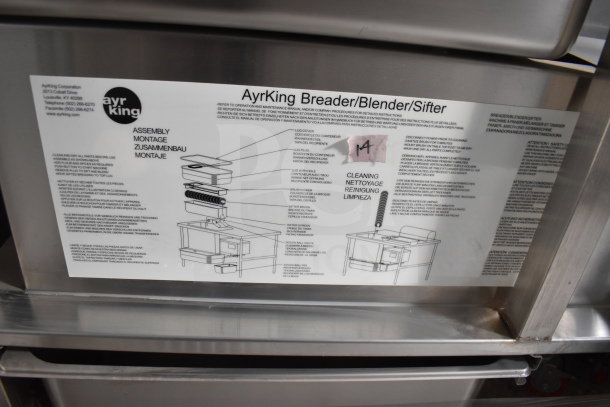 Guidelines for AyrKing Breader/Blender/Sifter assembly and cleaning displayed on a metal surface.