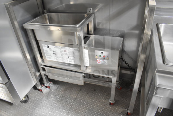 Texino 2021 cooking trailer interior with stainless steel equipment, featuring a visible AyrKing breader/blender/sifter unit.