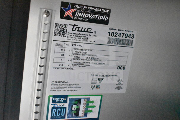 Label on True Refrigeration appliance, model TWT-27F-HC, showing specifications including voltage, refrigerant, and design pressures.