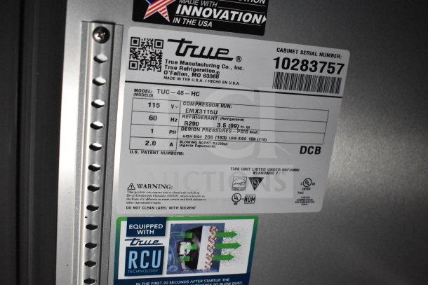 Label of True Refrigeration model TUC-48-HC showing specs: 115V, R290 refrigerant, compressor EMX3115U, serial 10283757.