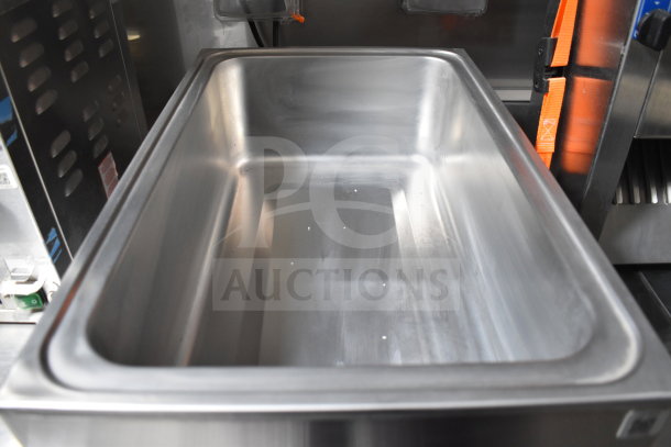 Stainless steel cooking bay inside Texino 2021 cooking trailer, part of a fully equipped Popeyes-configured setup.