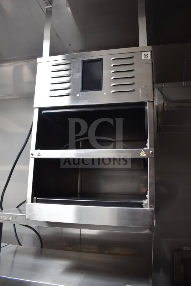 Stainless steel Ultrafryer Ultrastat23 4-bay fryer in new condition inside Texino cooking trailer.