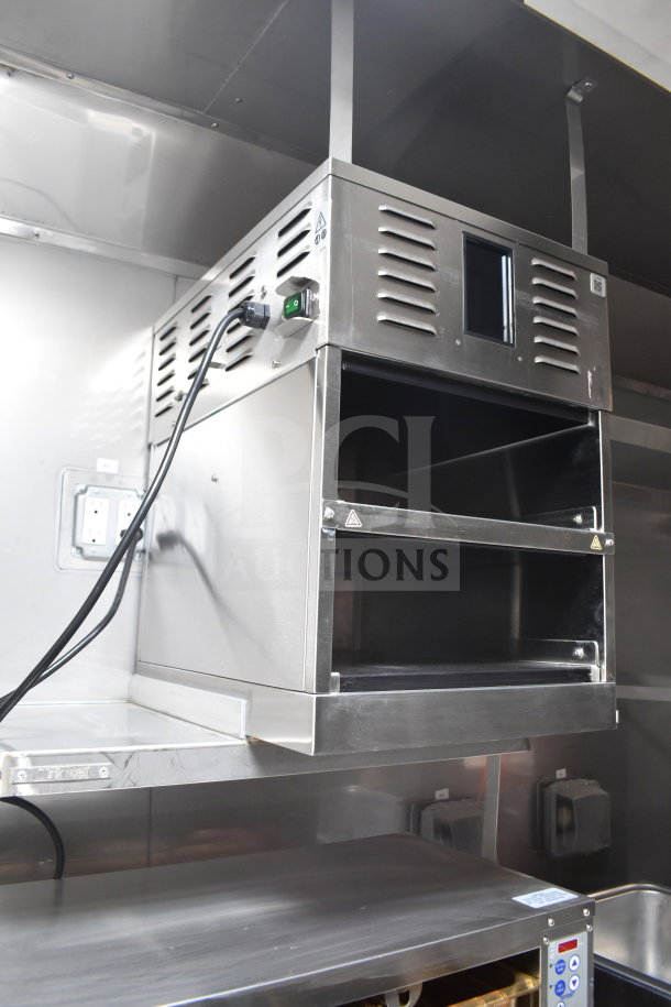 Stainless steel interior of a 2021 Texino cooking trailer featuring a Winston CVap holding cabinet.