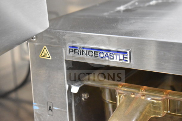 Prince Castle kitchen equipment, stainless steel finish, with heat warning symbol and brand logo visible.