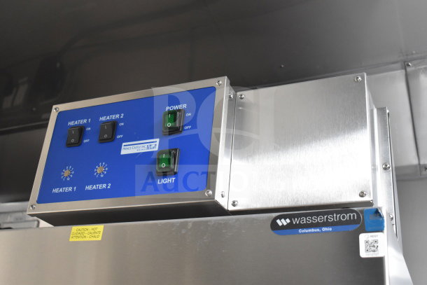 Control panel close-up of a 2021 Texino cooking trailer. Features power switches, heater controls, and signage from Prince Castle and Wasserstrom.