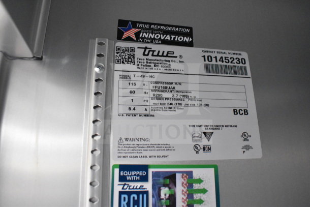 Texino cooking trailer label detailing True Refrigeration model T-49-HC specs, including voltage, refrigerant, and pressure.