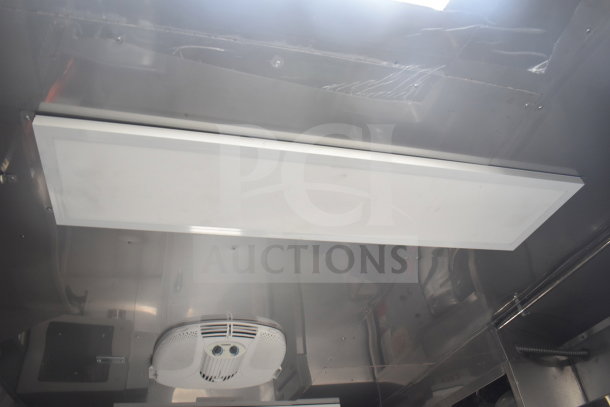 Interior view of 2021 Texino cooking trailer showing ceiling features, including ventilation and lighting systems.