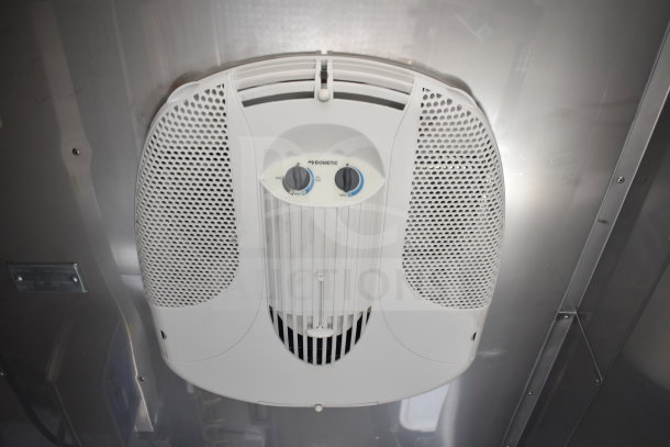 Ceiling-mounted Dometic ventilation unit inside Texino cooking trailer. Controls visible; sleek design.