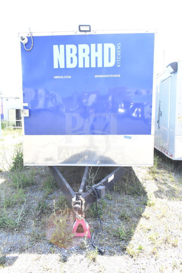 Rock Solid Cargo 8.5'x28' food trailer shell with CaptiveAire grease hood. Blue exterior, ready for outfitting. VIN: 7H2BE2837ND041749.