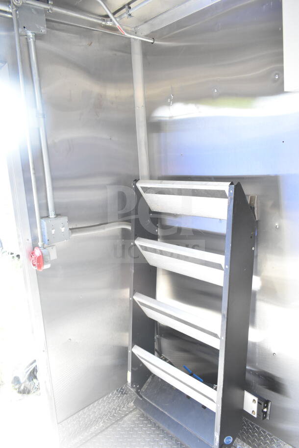 Rock Solid Cargo 8.5'x28' food trailer interior, featuring CaptiveAire grease hood. Ready for equipment installation.