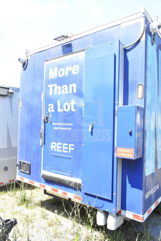 Rock Solid Cargo 8.5'x28' food trailer shell, blue exterior, equipped with CaptiveAire grease hood, ready for customization.